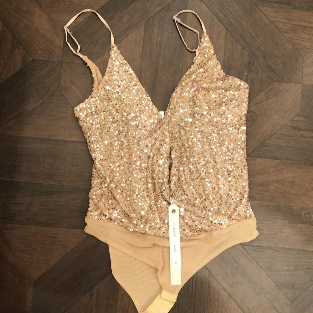 Brand new with tags sequin bodysuit. Never worn.